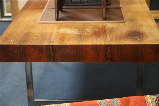 A Bodil Kjær rosewood freestanding working table desk with underframe of chromed steel W.6ft 7in. D.3ft 3in. H.2ft 3in.